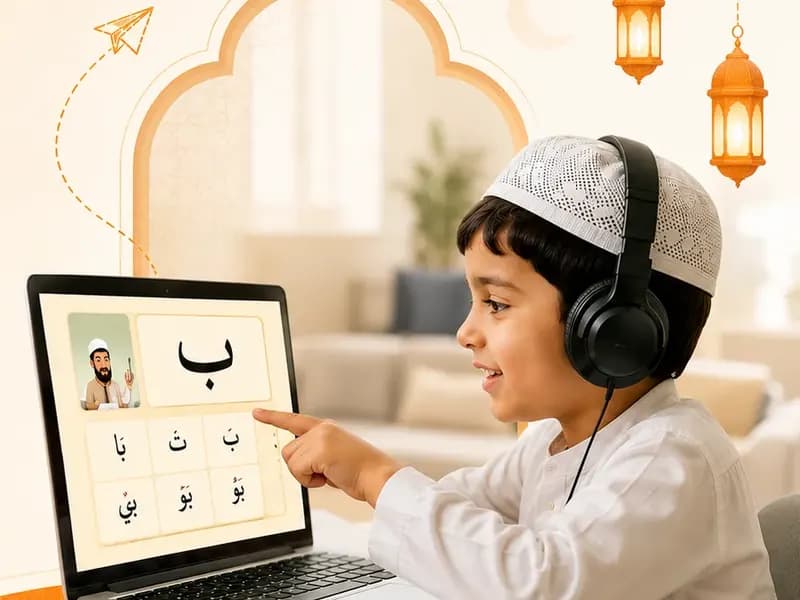 A boy pointing at Arabic letters during a live online Qaida lesson