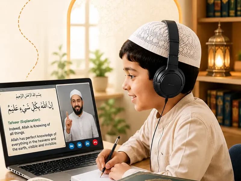 A student learning the meaning of the Quran with his teacher on screen