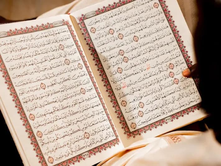 An open mushaf showing Arabic script